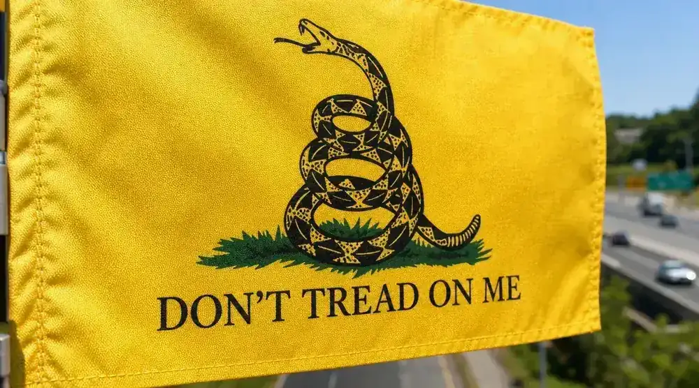 Close-up of the Anley Gadsden flag canvas header and double-stitched hem showing construction detail