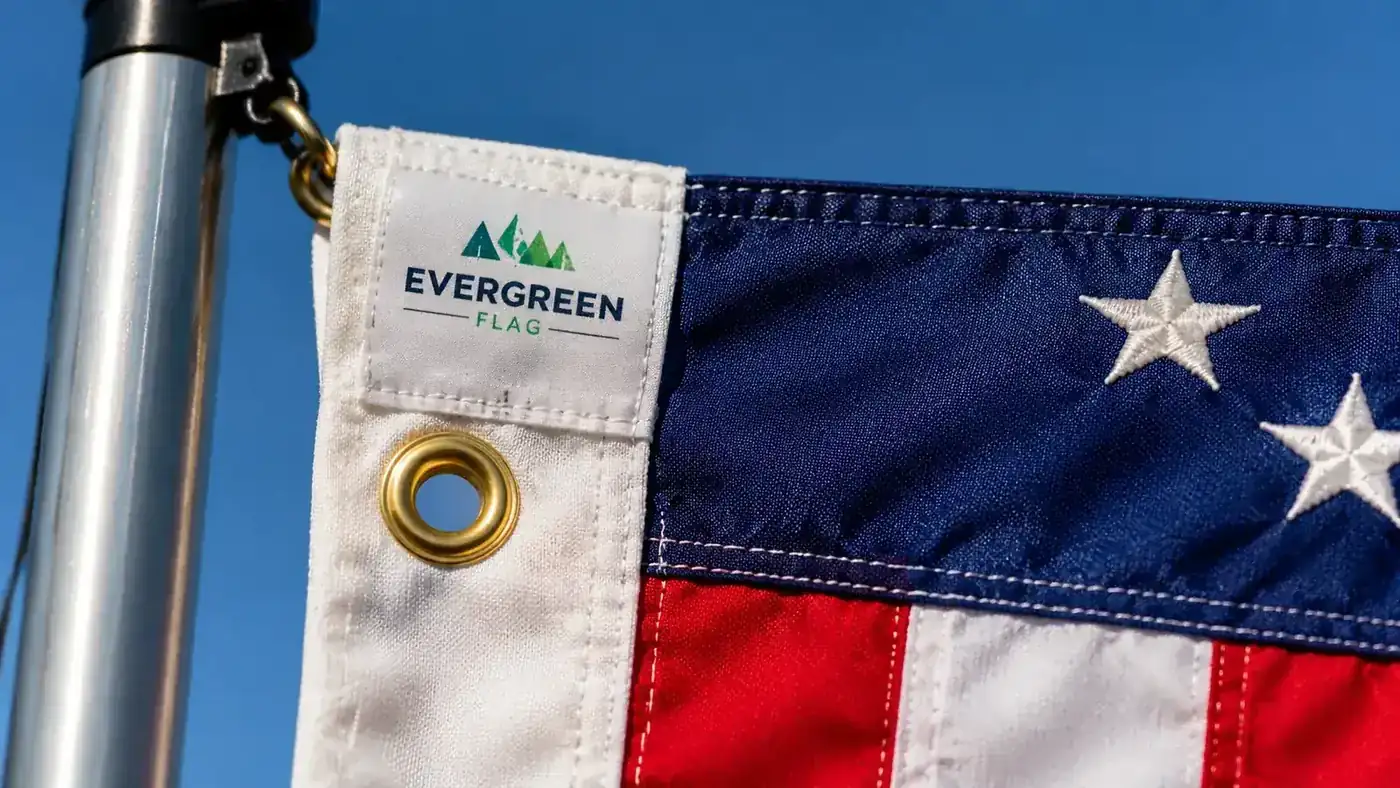Close-up of embroidered stars on an American flag attached to a flagpole mount on a semi truck