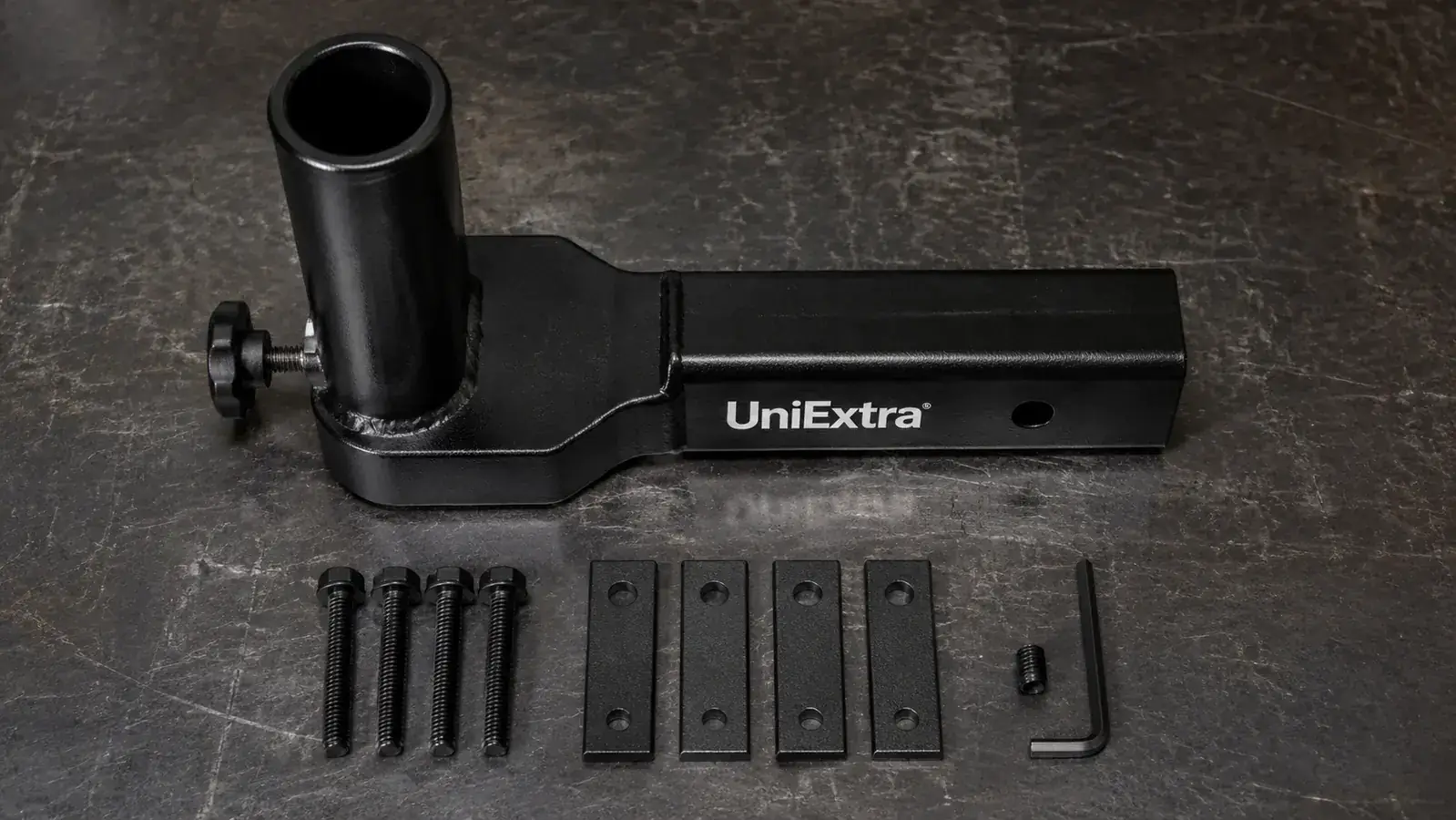 Close-up of UniExtra hitch mount clamping screws and steel collar installed in a 2-inch hitch receiver